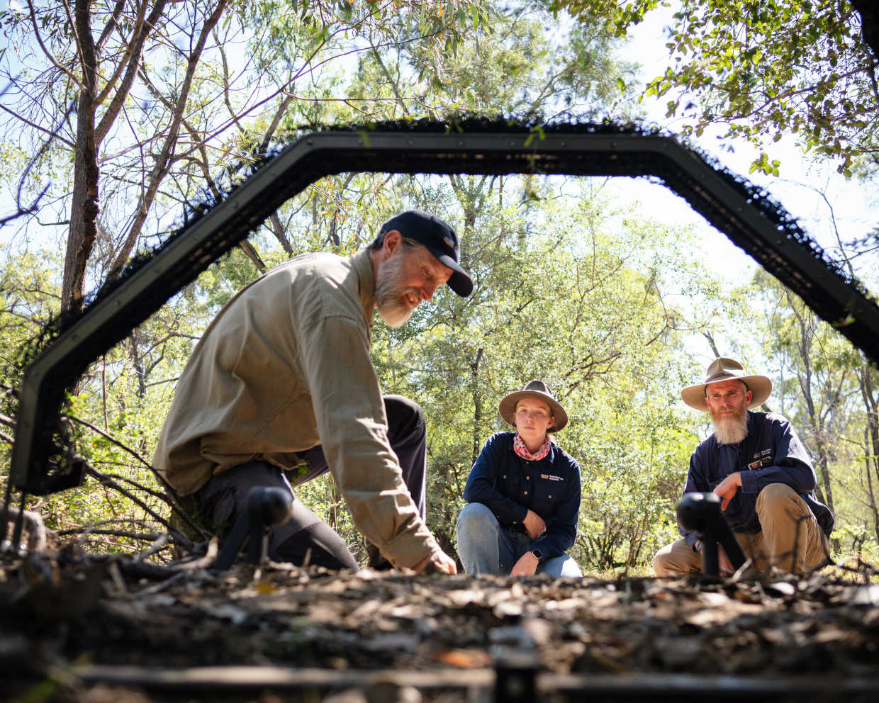 Ecologist James Smith demonstrates a HAND cat trap.